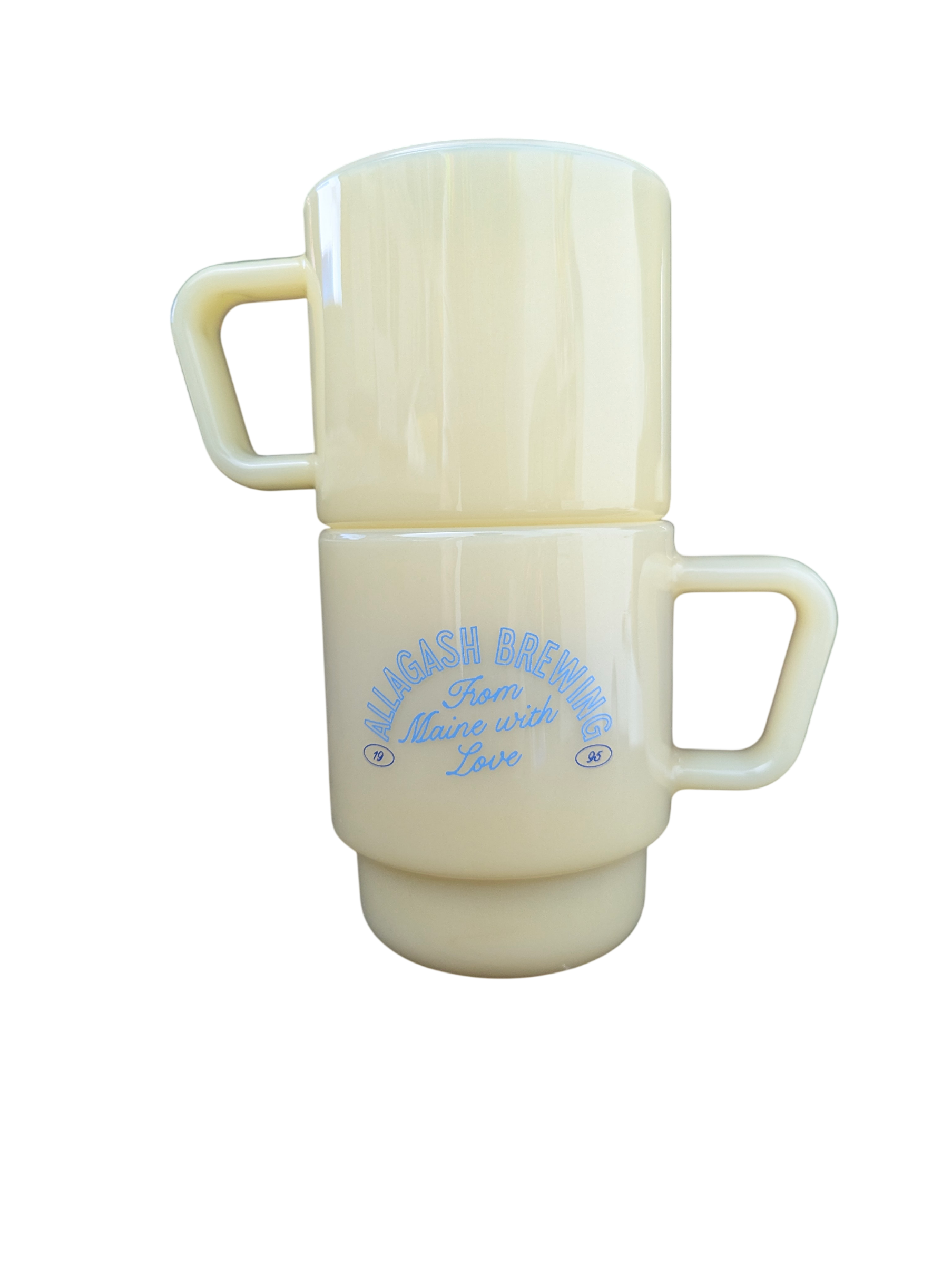 2 stacked milk-glass mugs with Allagash logo