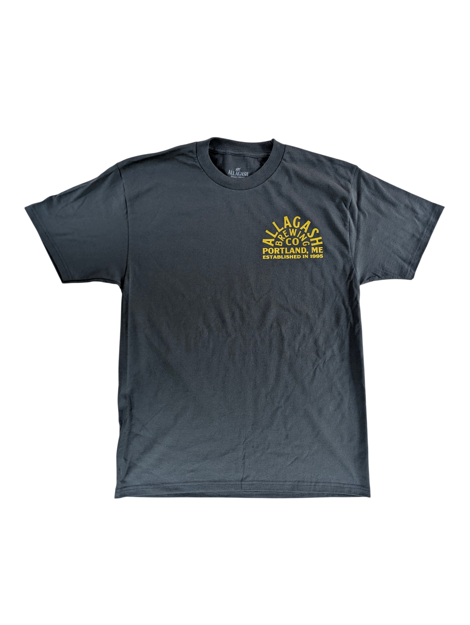 A black shirt with yellow text that reads Allagash Brewing Company Established 1995