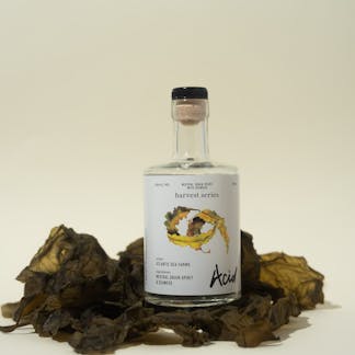 acid bottle on table with seaweed