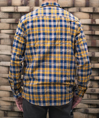 back of yellow and blue Flannel shirt worn by a model. (no design)