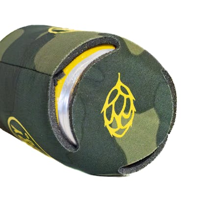 Detail of the bottom of camo beer koozie in use with a yellow can inside the koozie. There is a beer hop printed on the bottom in yellow ink