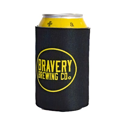 front of black beer koozie in use with a yellow can peeking out of the koozie. Bravery Brewing's logo with a circle around it is printed in yellow on front of the koozie.