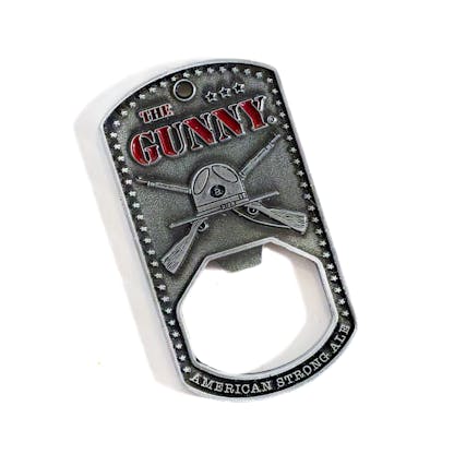 Front of Bravery The Gunny bottle opener on a white background. "The Gunny" text and can art is embossed with red accents. the text "American Strong Ale" is embossed along the bottom. small stars are embossed along the sides.