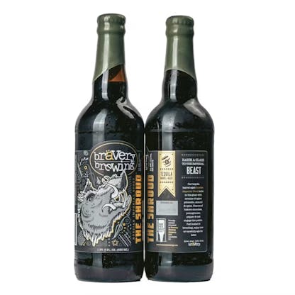 two bottles of The Shroud tequila barrel-aged beer, the left bottle showing the front label art, the right showing the label details