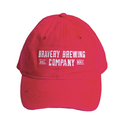 Front photo of bright pink baseball cap on a white background. The fabric hat has white embroidered text across the front two panels that says "BRAVERY BREWING COMPANY est 2011."