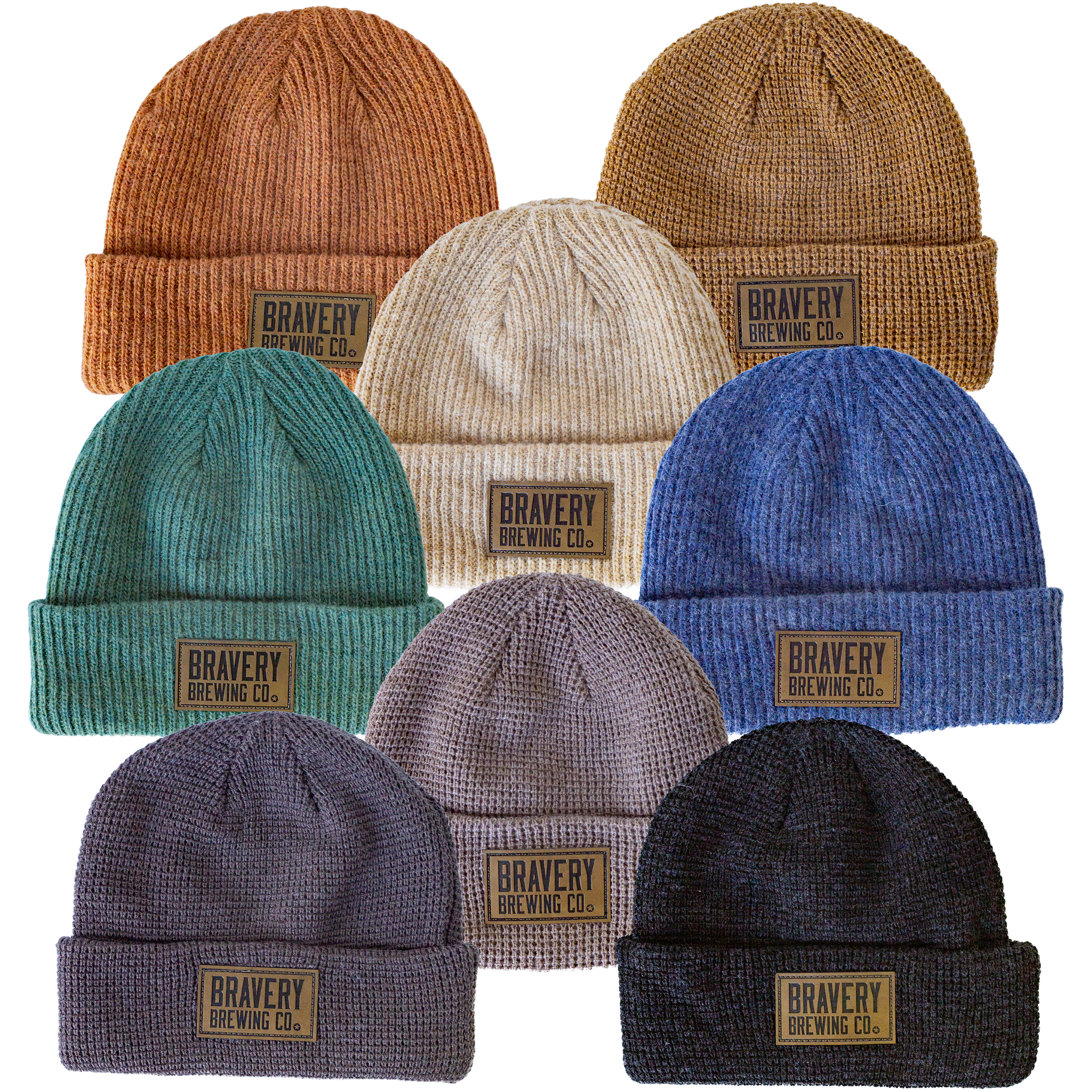 A photo of all of the knit beanie color options laying flat on a white background.